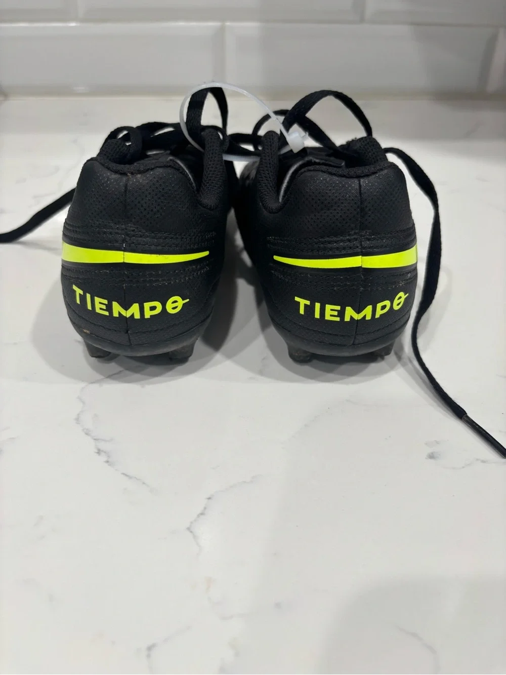 Nike Kids Black Soccer Cleats with Neon Yellow Swoosh
